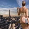 Woman on swing overlooks Paris skyline